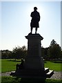 Silhouetted Robert Raikes statue