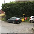 Yellow and red bins on the west side of Ludlow Road near Church Stretton