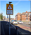 Bilingual road sign on the approach to a humped crossing, Station Road, Llanelli