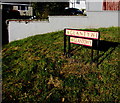 Two name signs on a grassy bank, Carmarthen