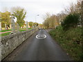 Minor road and a part of Rathen Parish Kirk burial ground