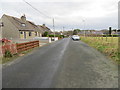 NK0159 : Minor road at Spillarsford Cottages, Cortes Village by Peter Wood