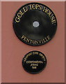 Black plaques on the wall of Gold Tops House, Pentonville, Newport