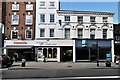 Shrewsbury, Castle Street: Inocencia menswear shop and Shrewsbury Ark Charity Shop