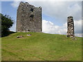 The tower of Moyry Castle and a surviving section of the bawn wall