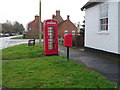 Elizabeth II postbox and telephone box on Main Street, Etton