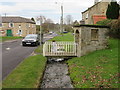 Bus shelter with running water