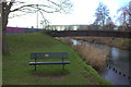 Bench and bridge on the River Slea