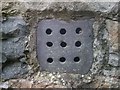 SH6268 : A slate ventilation grille at church, Llanllechid by Meirion