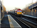 A bulk-haul freight train running through Thorne South station