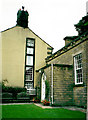 Gable end of Green Hollows and porch of the Friends