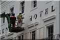SO9422 : Painters working on the George Hotel by Philip Halling
