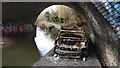 Burnt out car under the viaduct