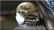 SK5701 : Burnt out car under the viaduct by Mat Fascione