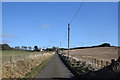 Long straight road in the Aberdeenshire countryside
