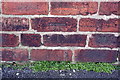 Benchmark on roadside wall of Brampton Primary School, Springfield Avenue