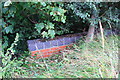 Brick parapet of culvert on NW side of A607 at Echo Spinney