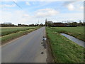 A drain enclosed Mill Road approaching Flaxlands