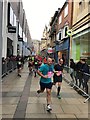 Half Marathon runners in Petty Cury, Cambridge