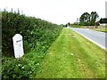 SW8657 : Old Milestone by the A3058, south of Tresillian Barton by Rosy Hanns