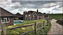 TQ1813 : Houses around Wyckham Farm by Ian Cunliffe