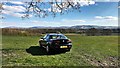 Car in a field - and view towards the South Downs