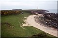 NH9486 : Coastline and raised beach at Port Tarsuinn near Tarbet Ness by Colin Park
