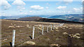 NT2531 : Fence descending from summit of Dun Rig - 2 by Trevor Littlewood
