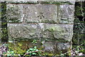 Benchmark on railway bridge abutment pier beside B6480