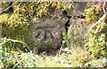 Benchmark on stone wall on west side of Kirk Syke Lane