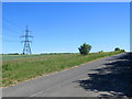 TL5649 : Pylons and the road to Balsham by John Sutton