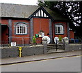 Yellow hydrant marker outside the village hall, Llanfrynach, Powys