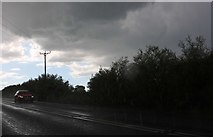 SP7233 : Heavy downpour on the A421, Thornborough by David Howard