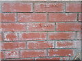 SH6268 : Brick wall with batch numbers showing on Ffordd Tan Y Bwlch, Rachub by Meirion