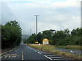 Brockworth village sign on A46