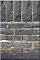 Benchmark on wall on NE side of Wilmer Road