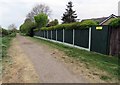 Garden fence on Kirby Lane westwards