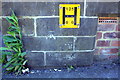 Benchmark and hydrant sign on wall of steps to synagogue on Bowland Street
