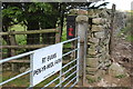 E R post box on farm gatepost