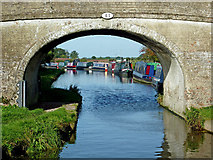 SJ7725 : Canal bridge and moorings near High Offley by Roger  D Kidd