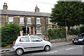 A parked car and houses on Heaton Road