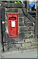 Benchmark under letter box at SE end of Commercial Street