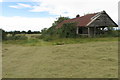 Derelict building by the footpath to Three Corners Piece