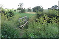 Crossing a stream on the footpath to Cow Ground Buildings