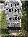 Old Milestone by the former A390, (in 2020)