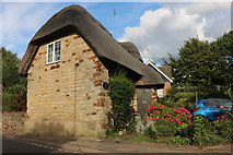 SP7253 : Tudor Cottage on High Street, Blisworth by David Howard