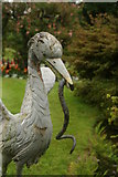 SS6140 : Heron and eel at entrance to Victorian Garden at Arlington Court by Chris