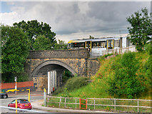 SD7807 : Metrolink Tram Crossing Spring Lane by David Dixon