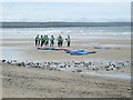 Paddleboarders limbering up on Traeth Llydan