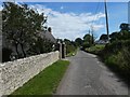 Flint wall and ornate gateposts, Southover